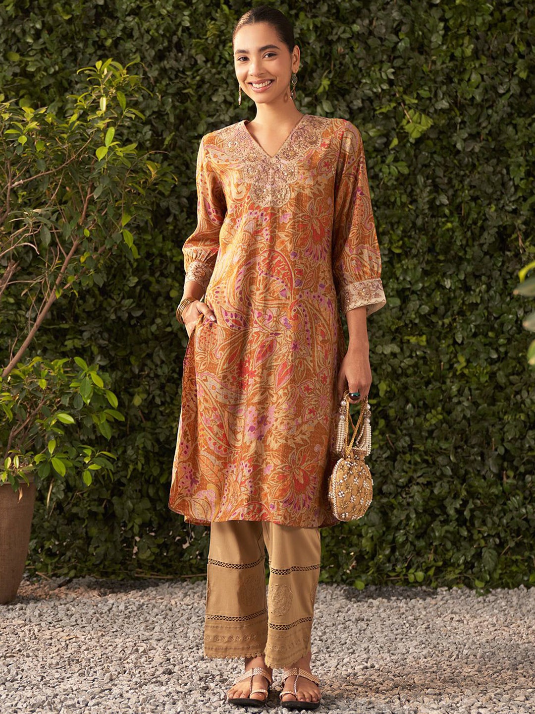 

Lakshita Women Ethnic Motifs Printed Flared Sleeves Thread Work Kurta, Mustard