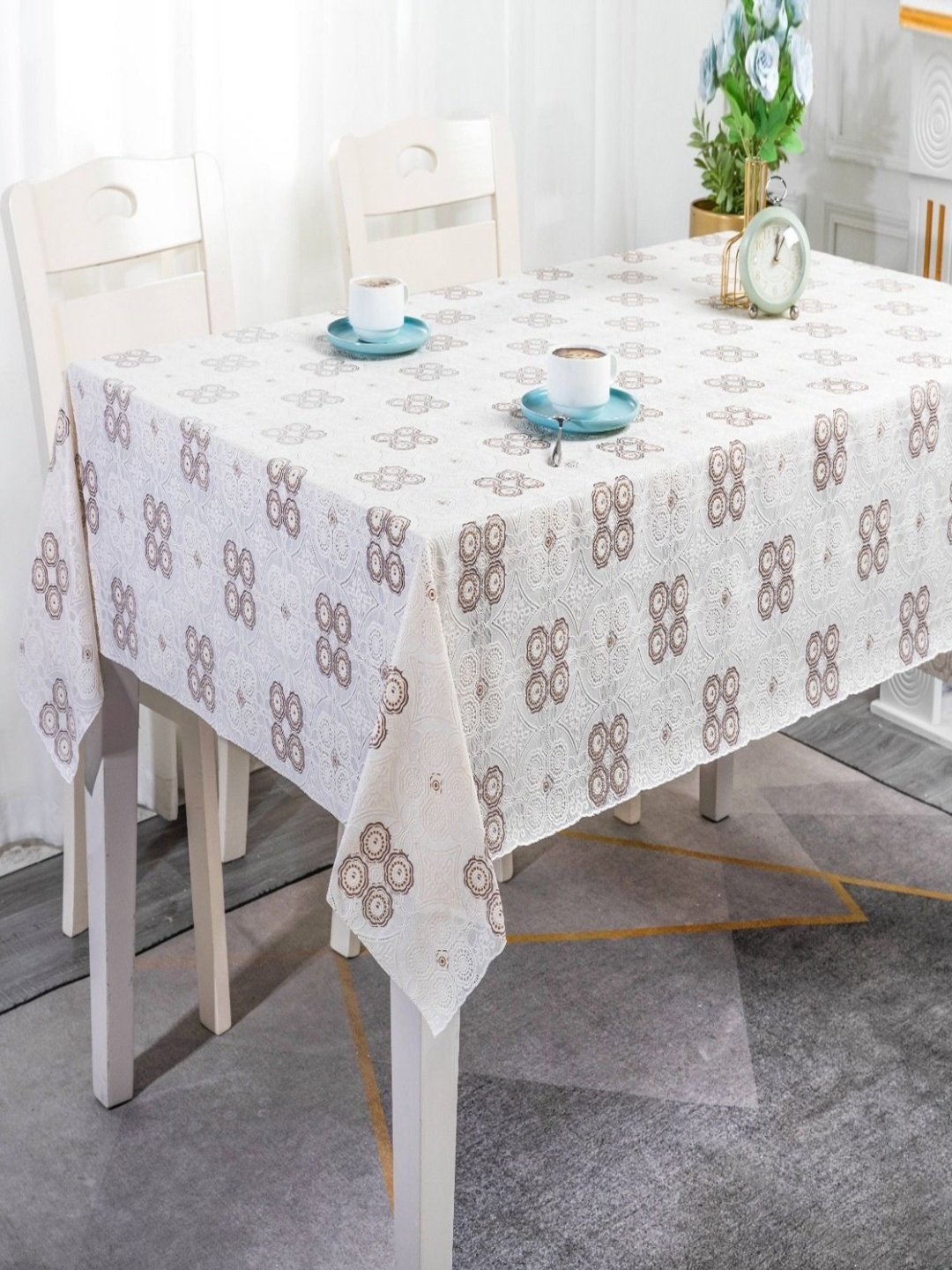 

Dakshya Industries White Floral Waterproof Plastic 6-Seater Table Cover