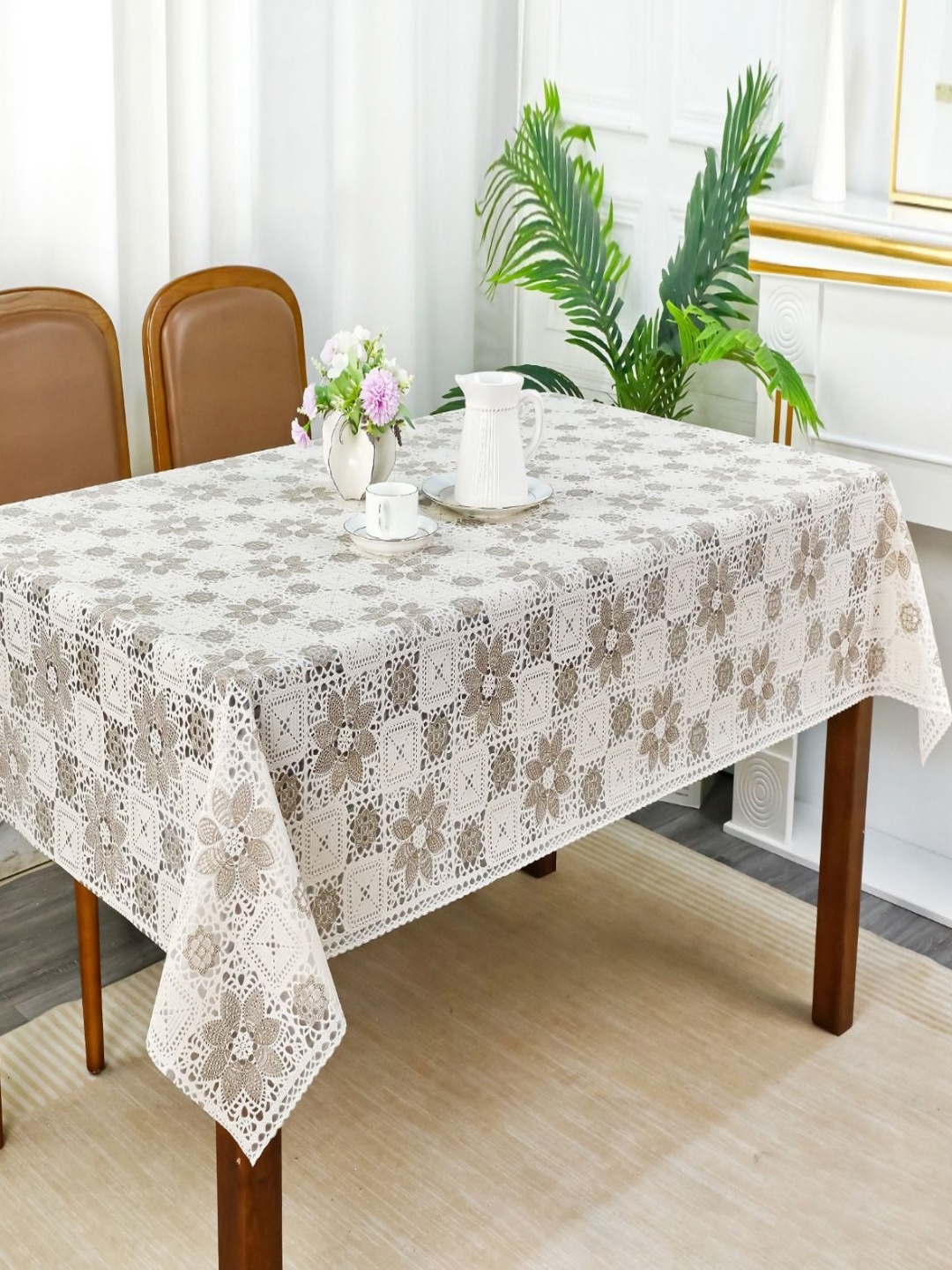 

Dakshya Industries White Floral Waterproof Plastic 6-Seater Table Cover