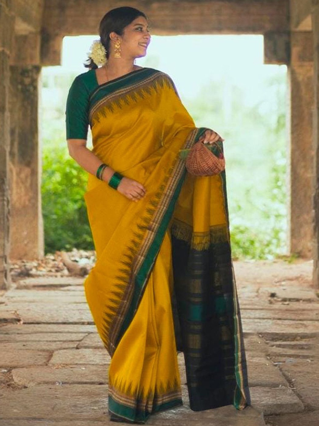 

DIVASTRI Ethnic Motifs Zari Art Silk Saree, Mustard