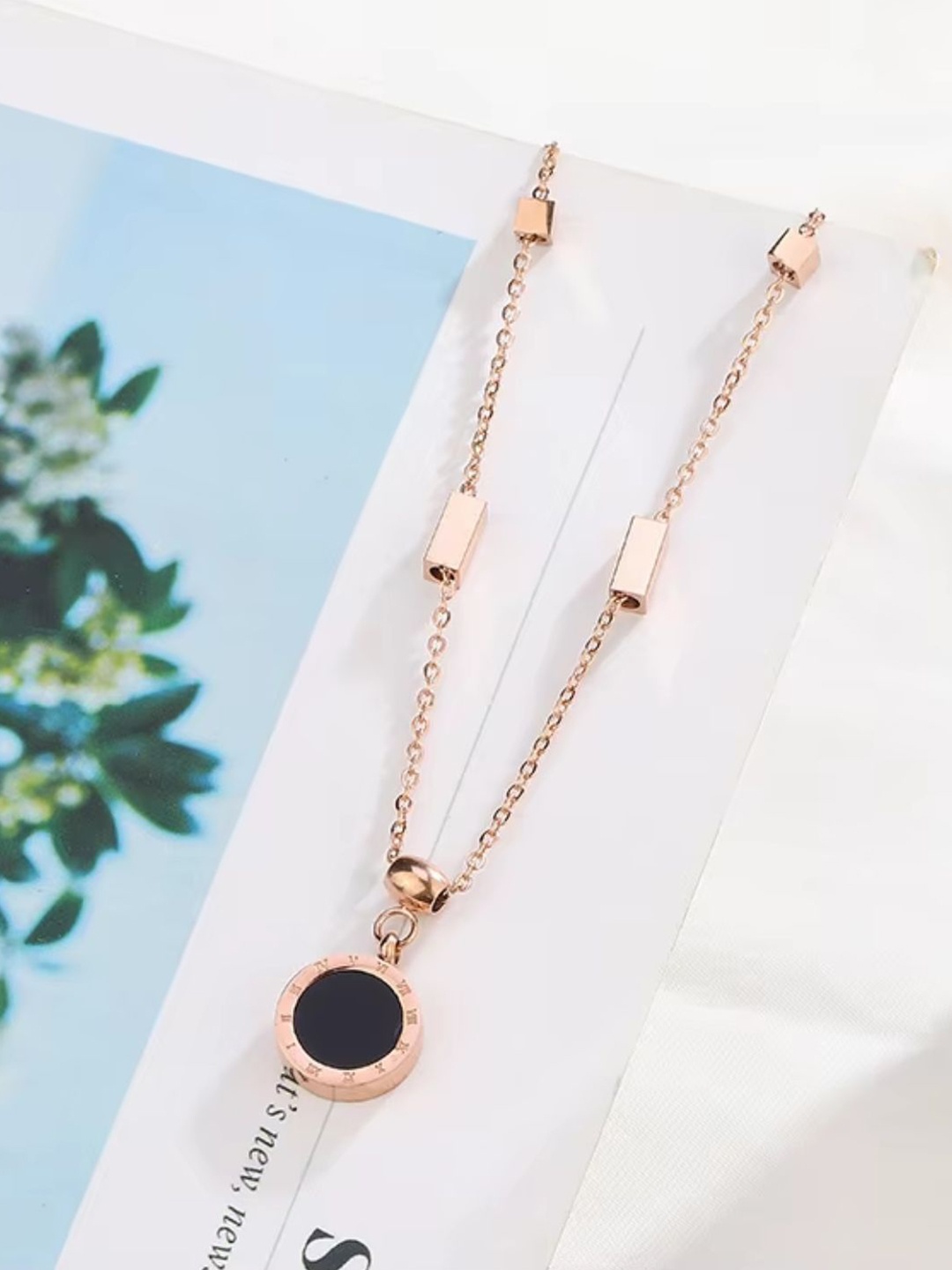 

Lyriss Rose Gold Plated Cubic Zirconia Studded Round Pendant With Chain