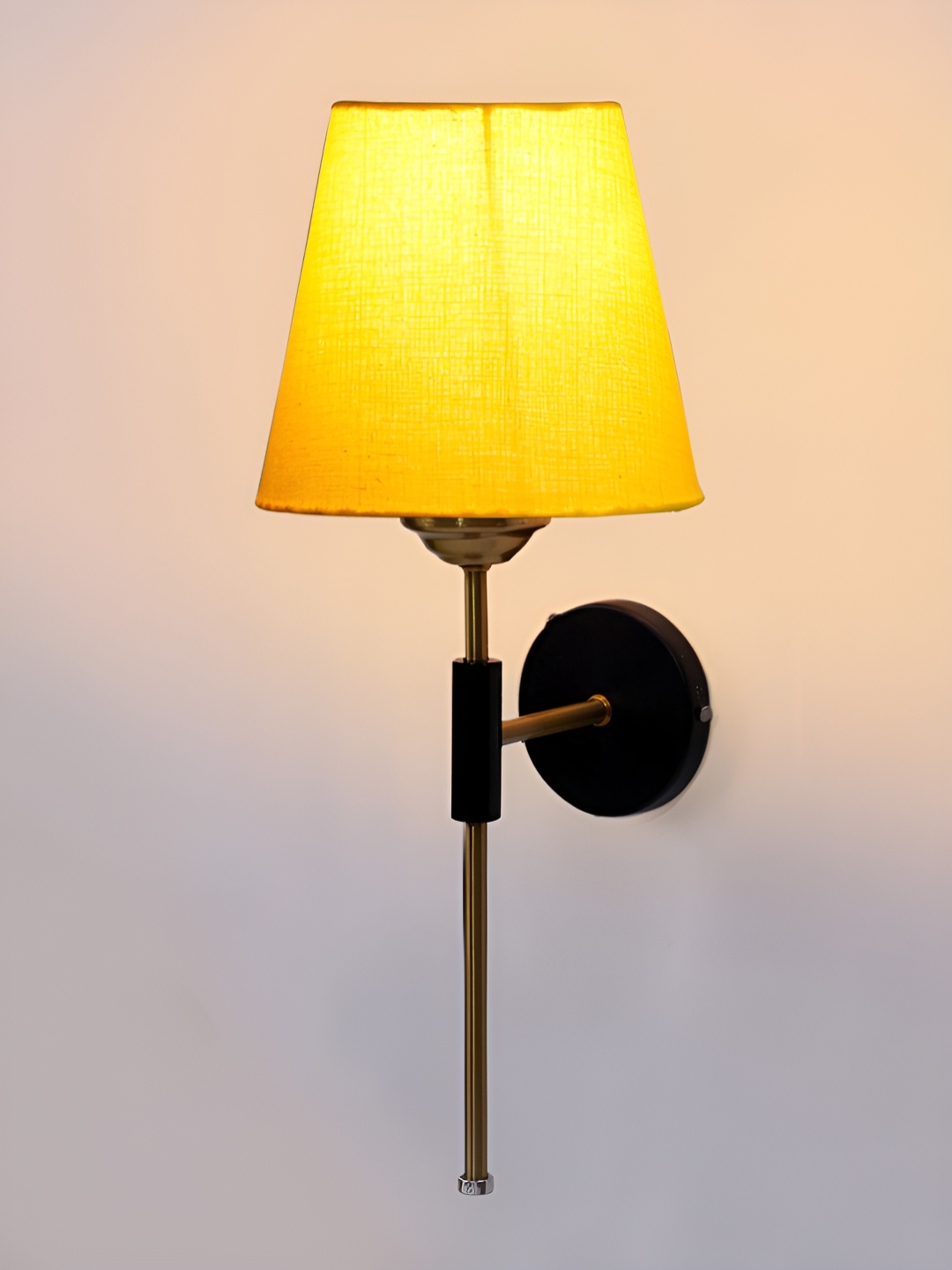 

Devansh Yellow Metal Traditional Abstract Shaped Shaped Wall Lamp