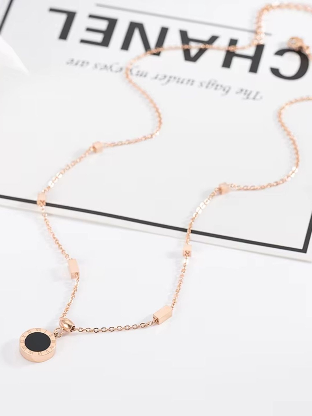 

Lyriss Rose Gold Plated Cubic Zirconia Studded Round Pendant With Chain