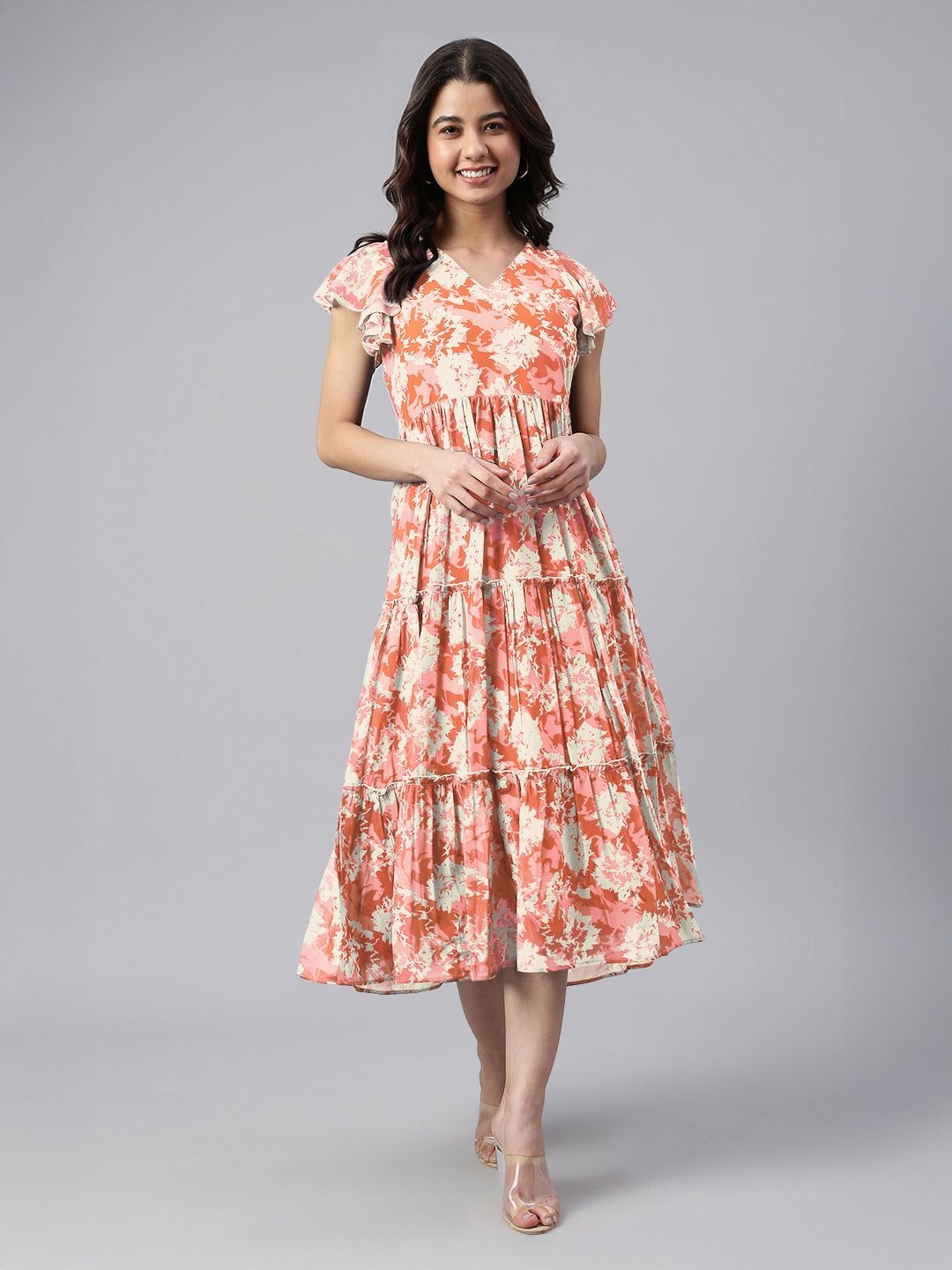 

Janasya Women's Orange Georgette Abstract Printed Tiered Dress