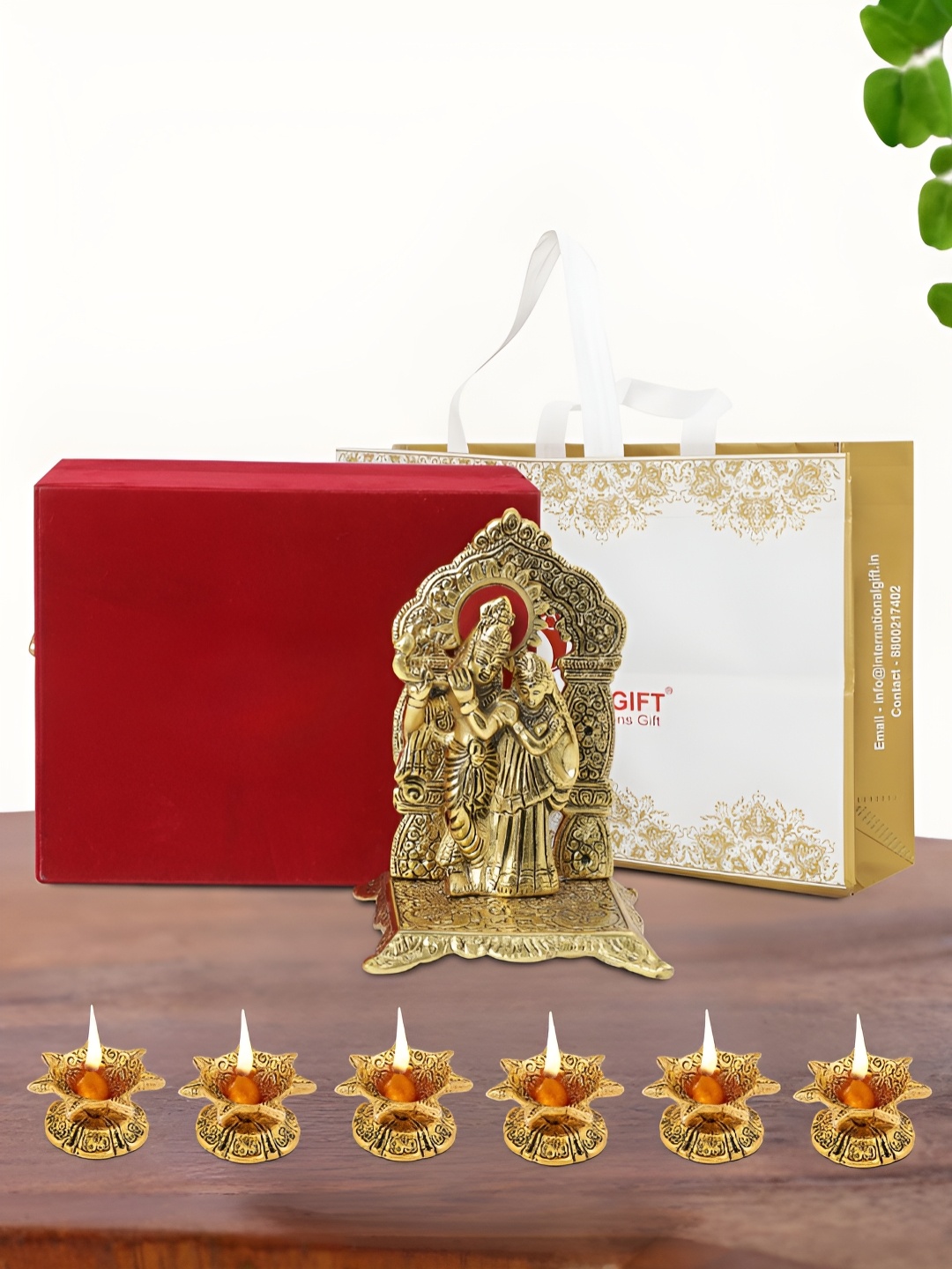 

INTERNATIONAL GIFT Gold Plated Radha Krishna Chowki with 6 Diya Box and Bag