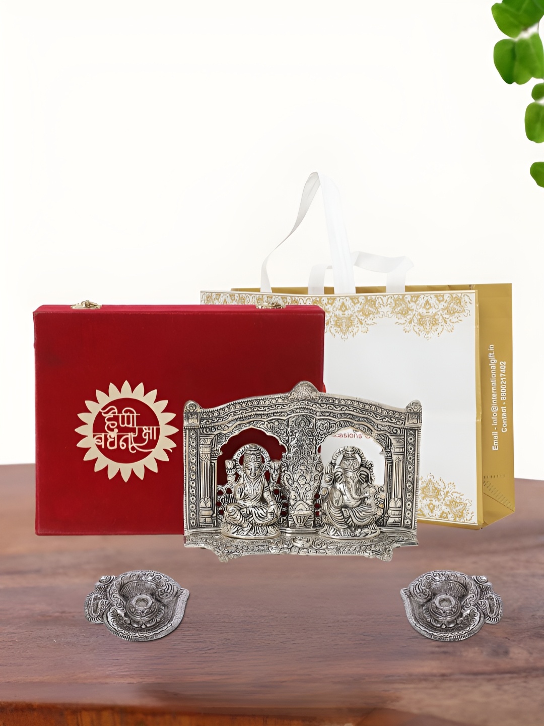 

INTERNATIONAL GIFT Silver Plated Laxmi Ganesh Idol with 2 Diya Box and Bag