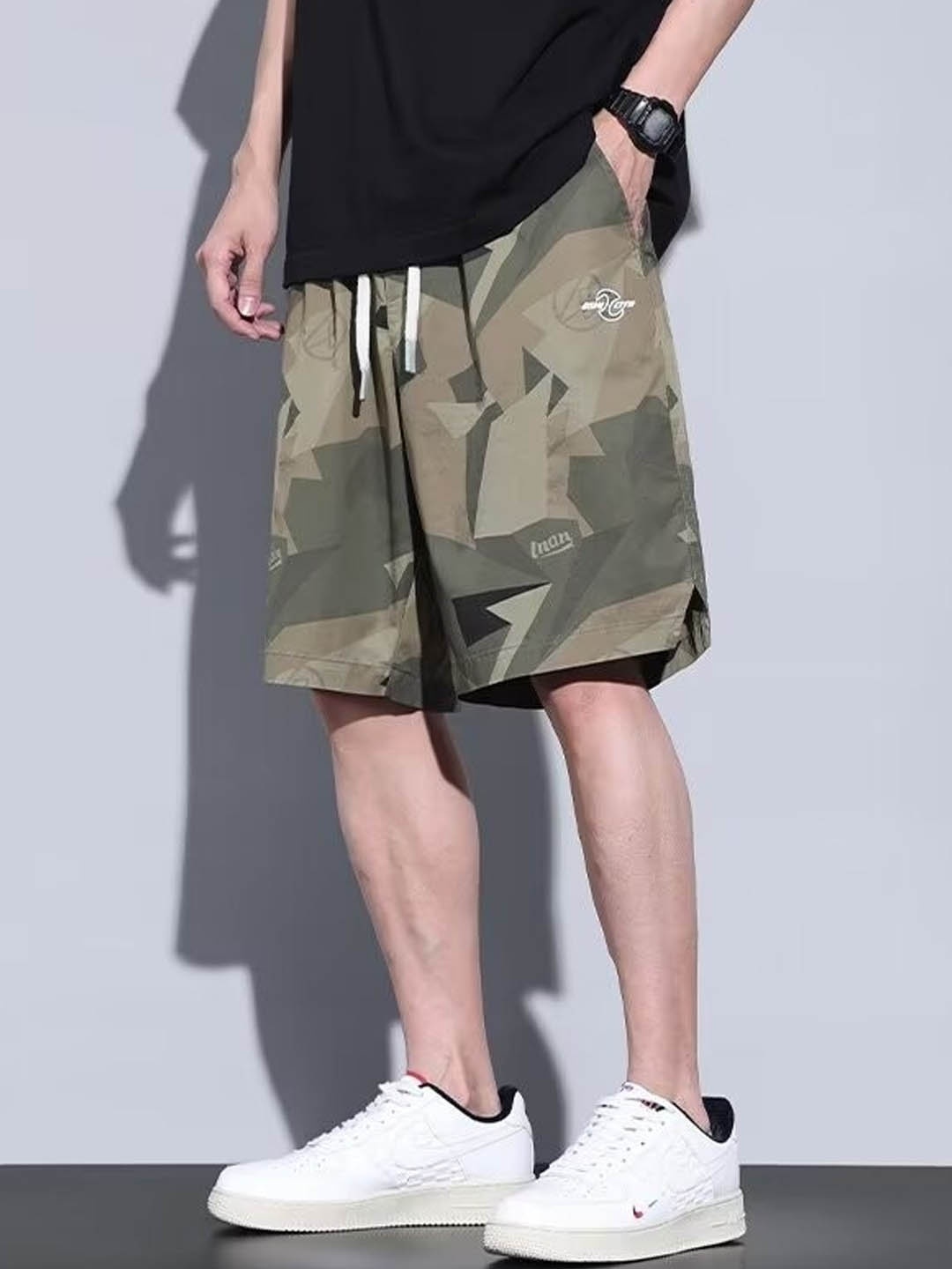 

StyleCast Men Camouflage Printed Mid-Rise Shorts, Green