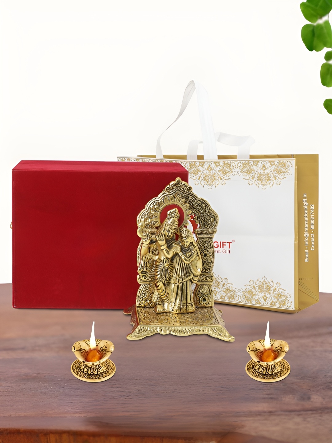 

INTERNATIONAL GIFT Gold Plated Radha Krishna Chowki with 2 Diya Box and Bag