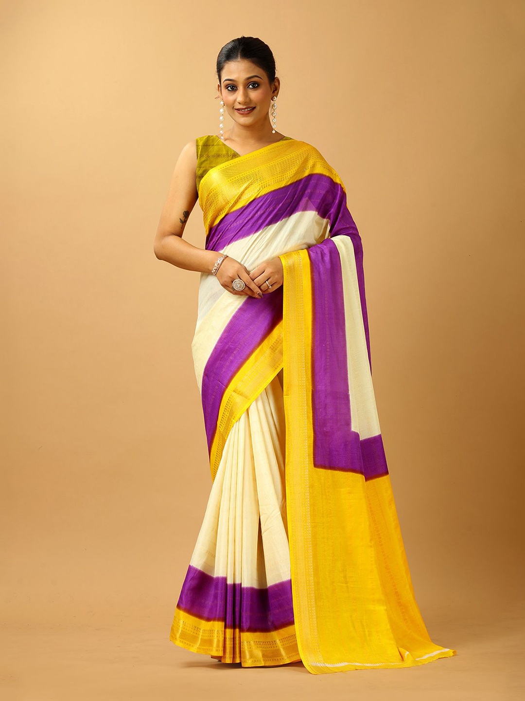 

A.V.M. SILK MILLS Woven Design Colourblocked Zari Saree, Cream