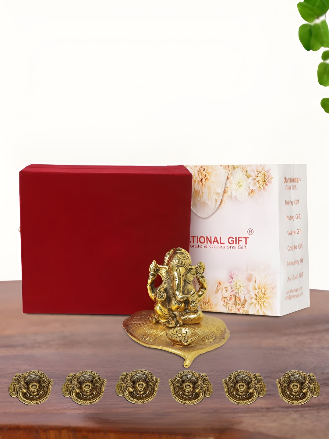 

INTERNATIONAL GIFT Gold Plated Leaf Ganesh Idol with 6 Diya Box and Bag