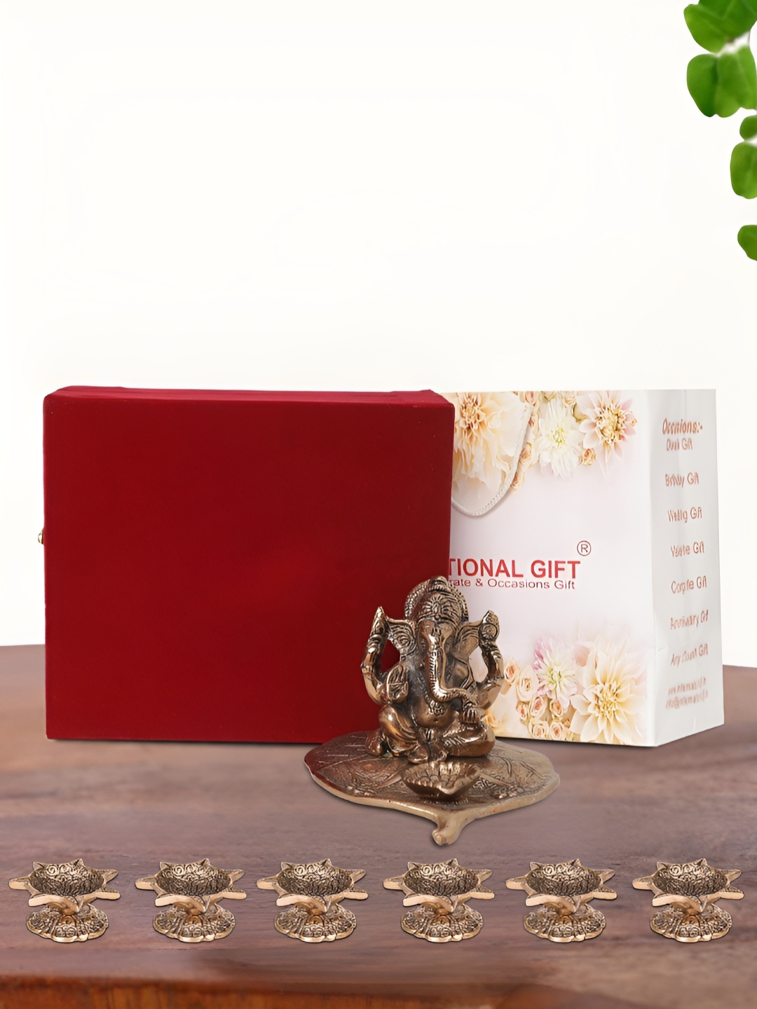

INTERNATIONAL GIFT Brown Leaf Ganesh Idol with 6 Diya Box and Bag
