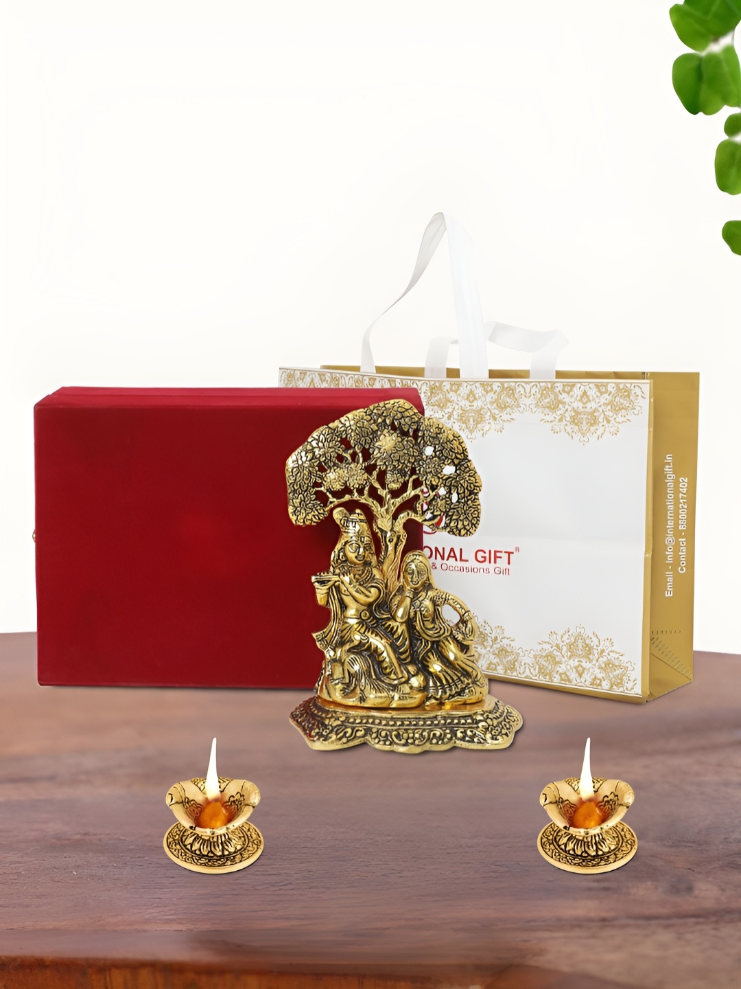 

INTERNATIONAL GIFT Gold Plated Radha Krishna Idol with 2 Diya Box and Bag