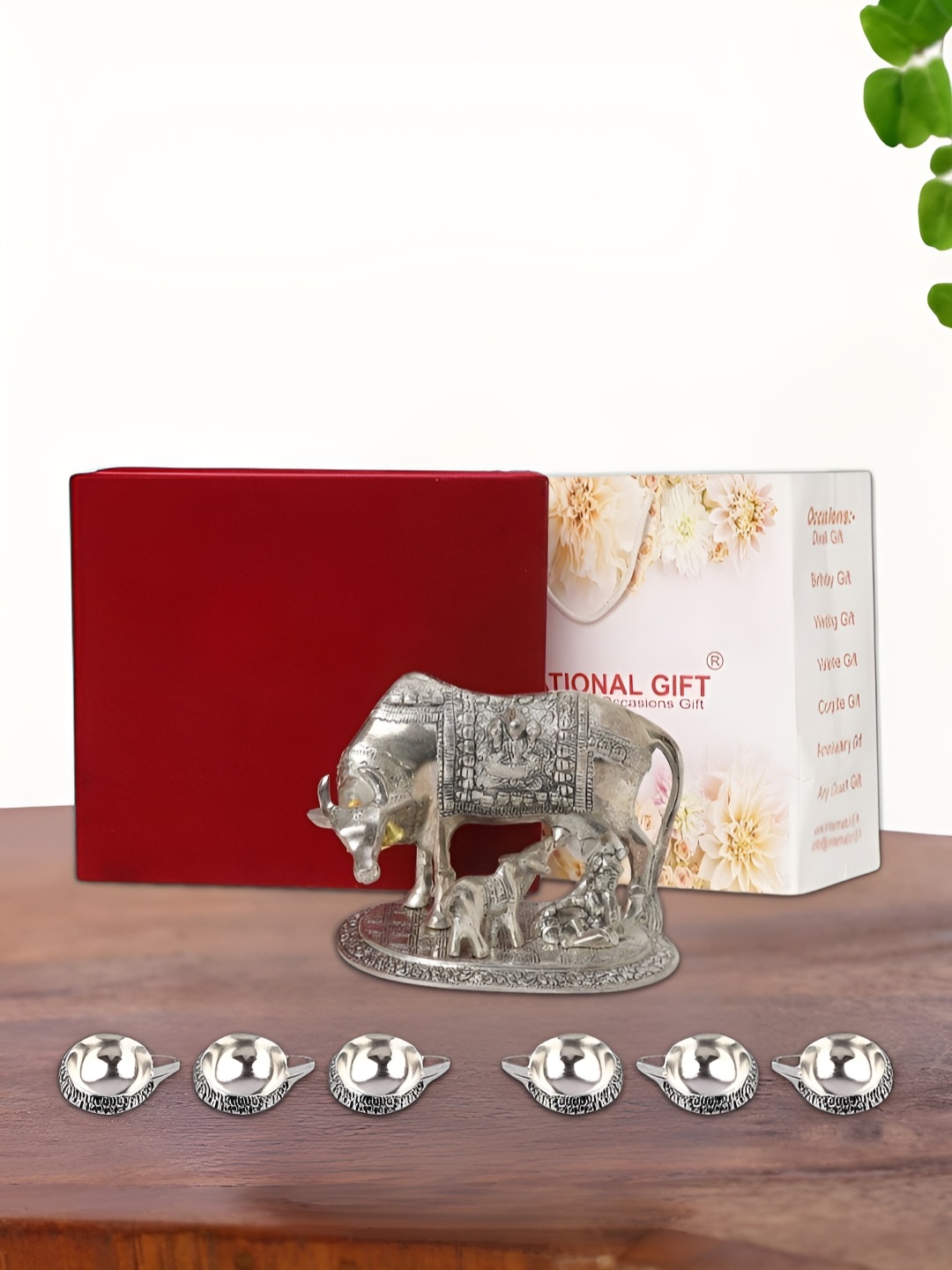 

INTERNATIONAL GIFT Silver Plated Kamdhenu Cow with 6 Diya Box and Bag