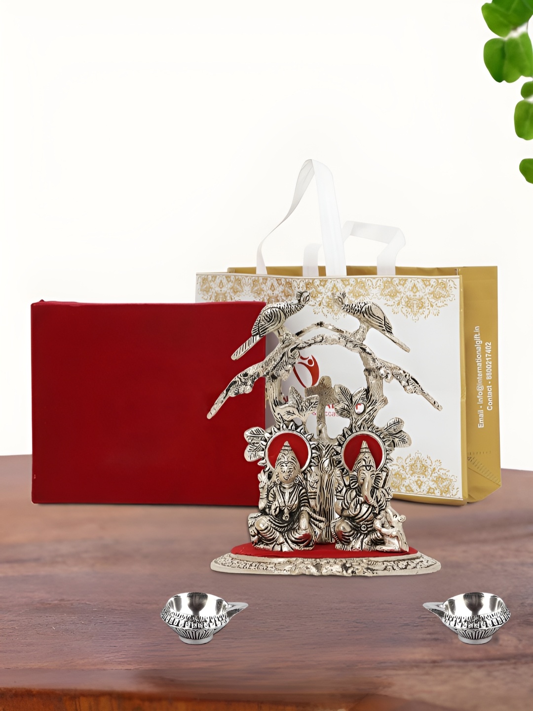 

INTERNATIONAL GIFT Silver Plated Laxmi Ganesh Idol with 2 Diya Box and Bag