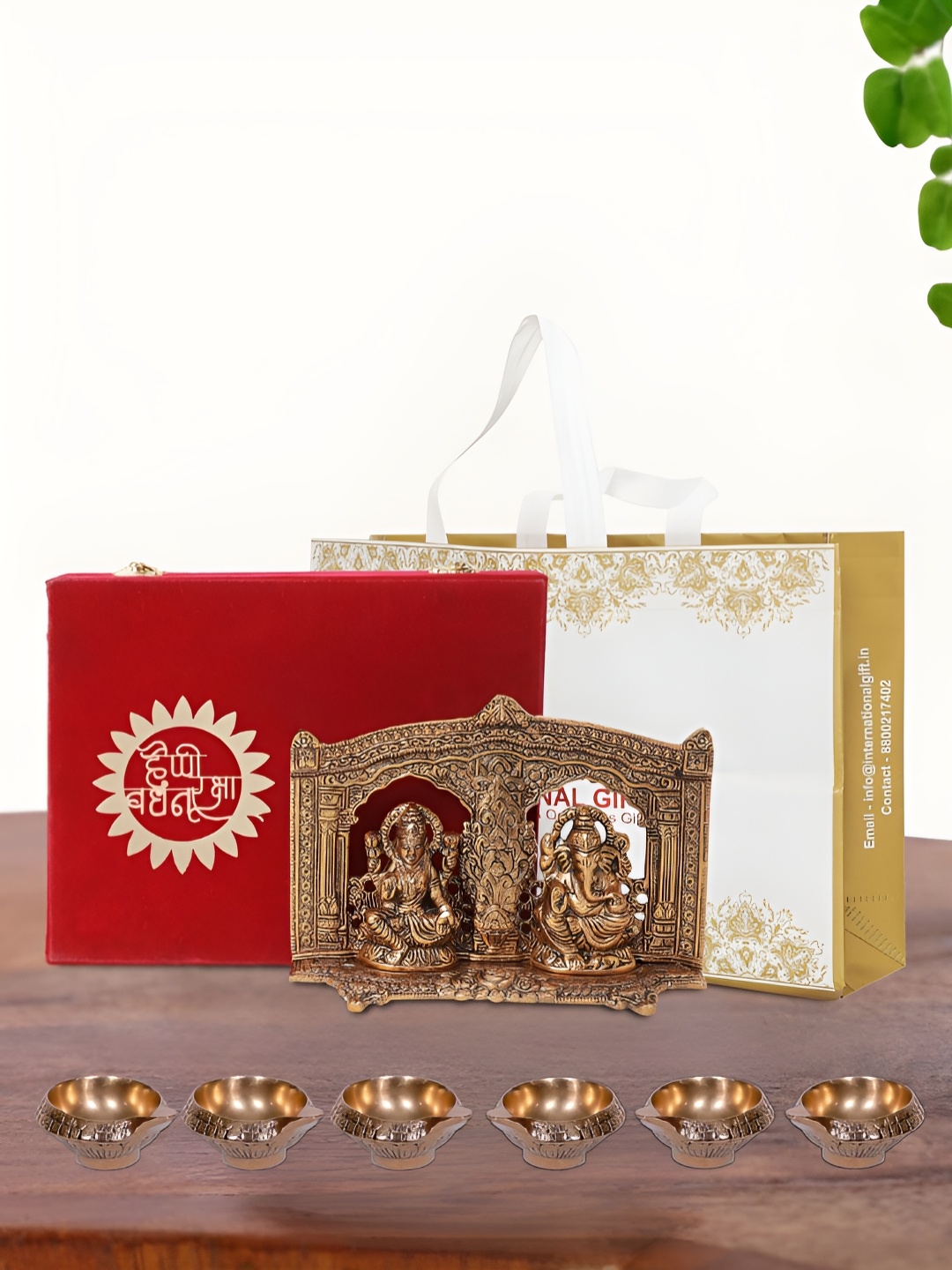 

INTERNATIONAL GIFT Brown Laxmi Ganesh Idol with 6 Diya Box and Bag, Copper