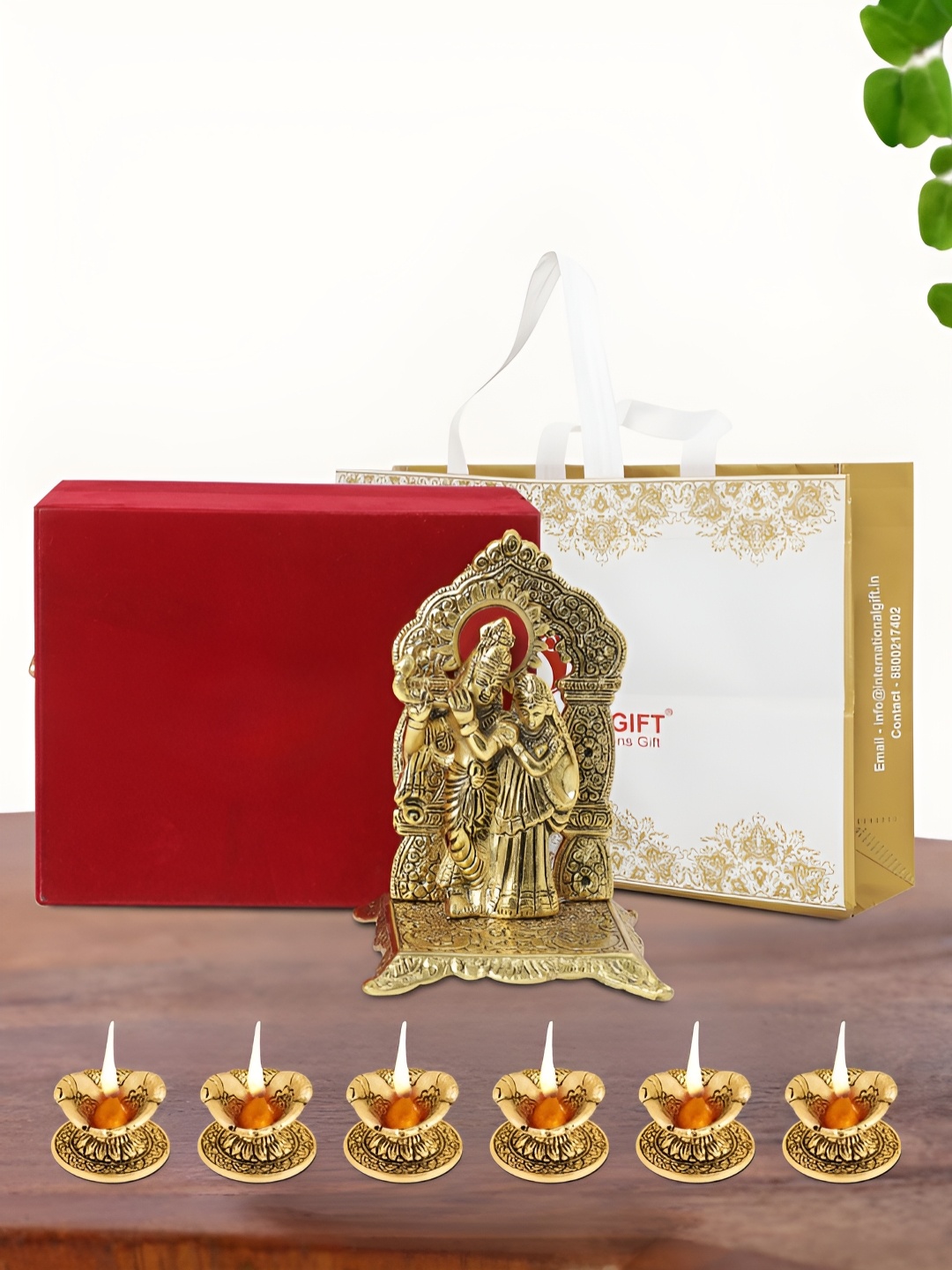 

INTERNATIONAL GIFT Gold Plated Radha Krishna Chowki with 6 Diya Box and Bag