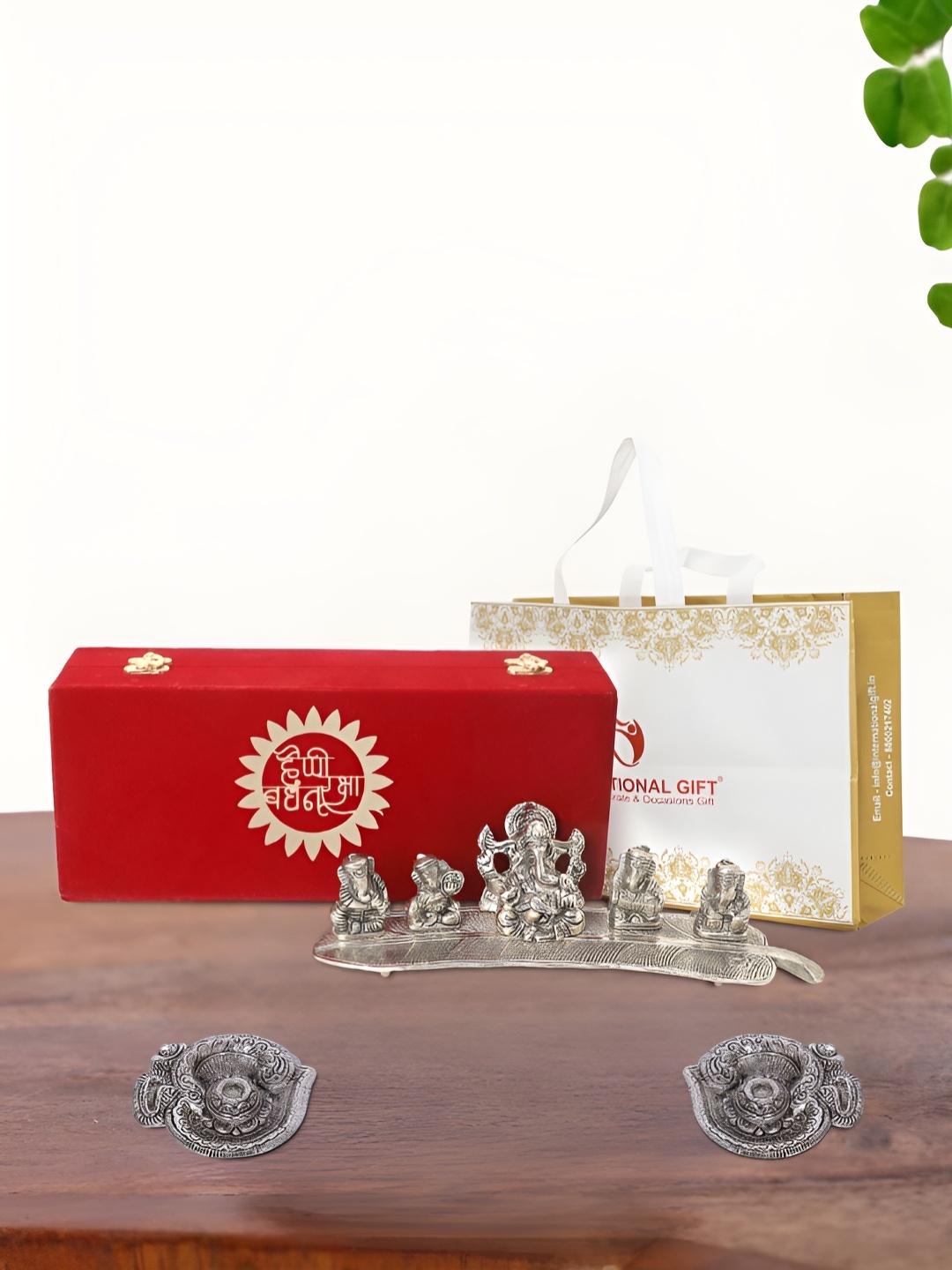 

INTERNATIONAL GIFT Silver Plated Musical Ganesh Idol with 2 Diya and Box