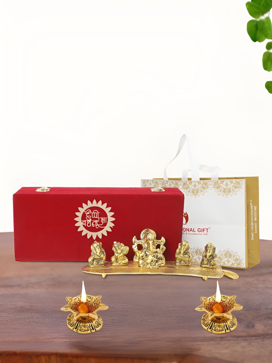 

INTERNATIONAL GIFT Gold Plated Musical Ganesh Idol with 2 Diya Box and Bag