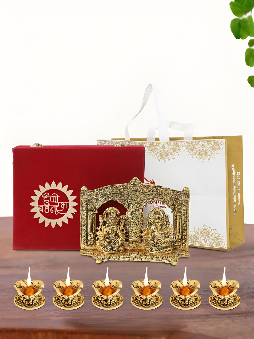 

INTERNATIONAL GIFT Gold Plated Laxmi Ganesh Idol with 6 Diya Box and Bag