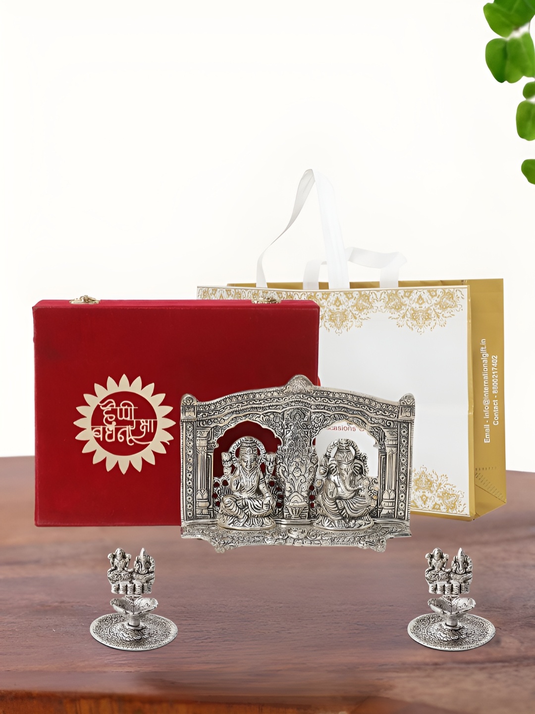 

INTERNATIONAL GIFT Silver Plated Laxmi Ganesh Idol with 2 Diya Box and Bag