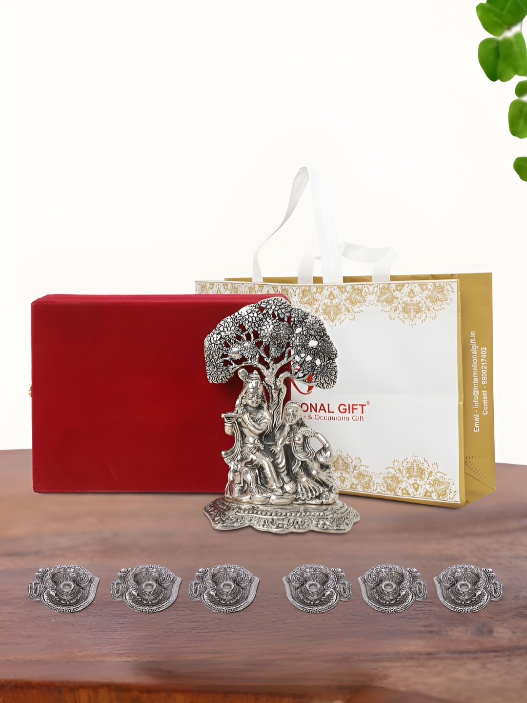 

INTERNATIONAL GIFT pooja & home dcor Silver-Toned Religious Idol Showpiece With 6 Diya