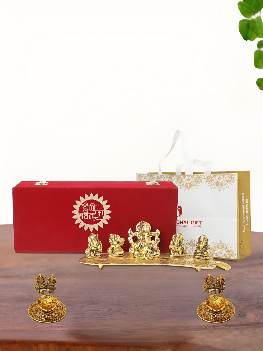 

INTERNATIONAL GIFT Gold Plated Musical Ganesh Idol with 2 Diya Box and Bag