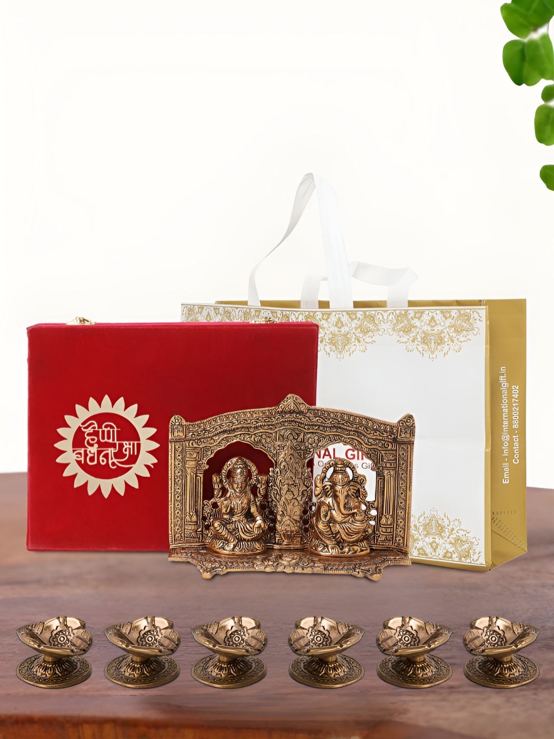 

INTERNATIONAL GIFT Brown Laxmi Ganesh Idol with 6 Diya Box and Bag, Copper