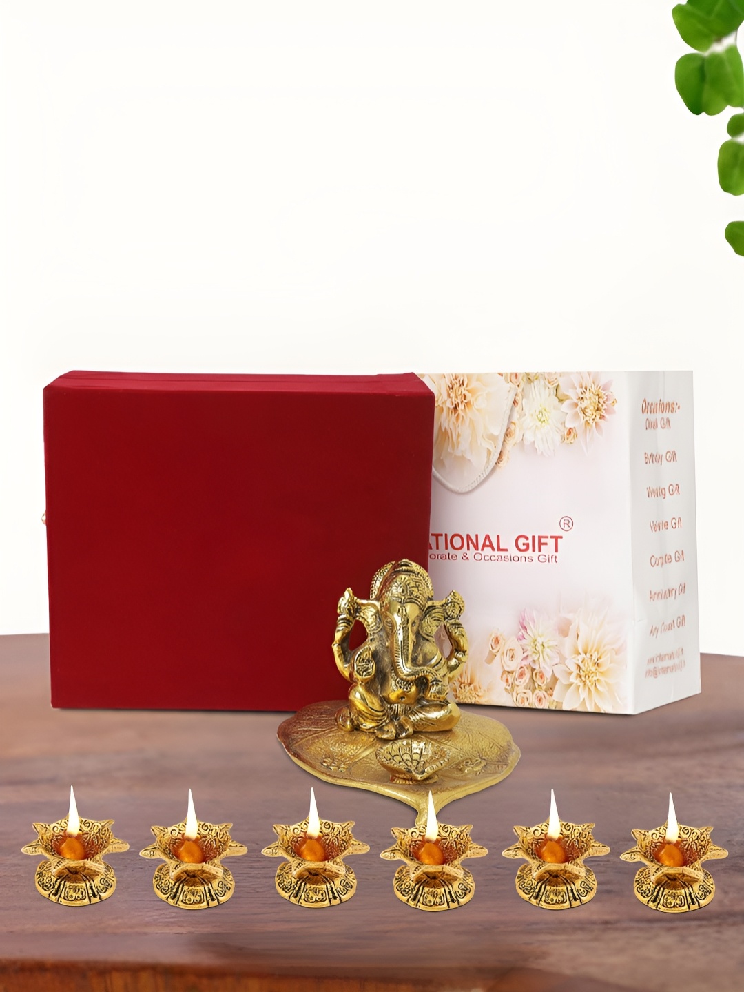 

INTERNATIONAL GIFT Gold Plated Leaf Ganesh Idol with 6 Diya Box and Bag