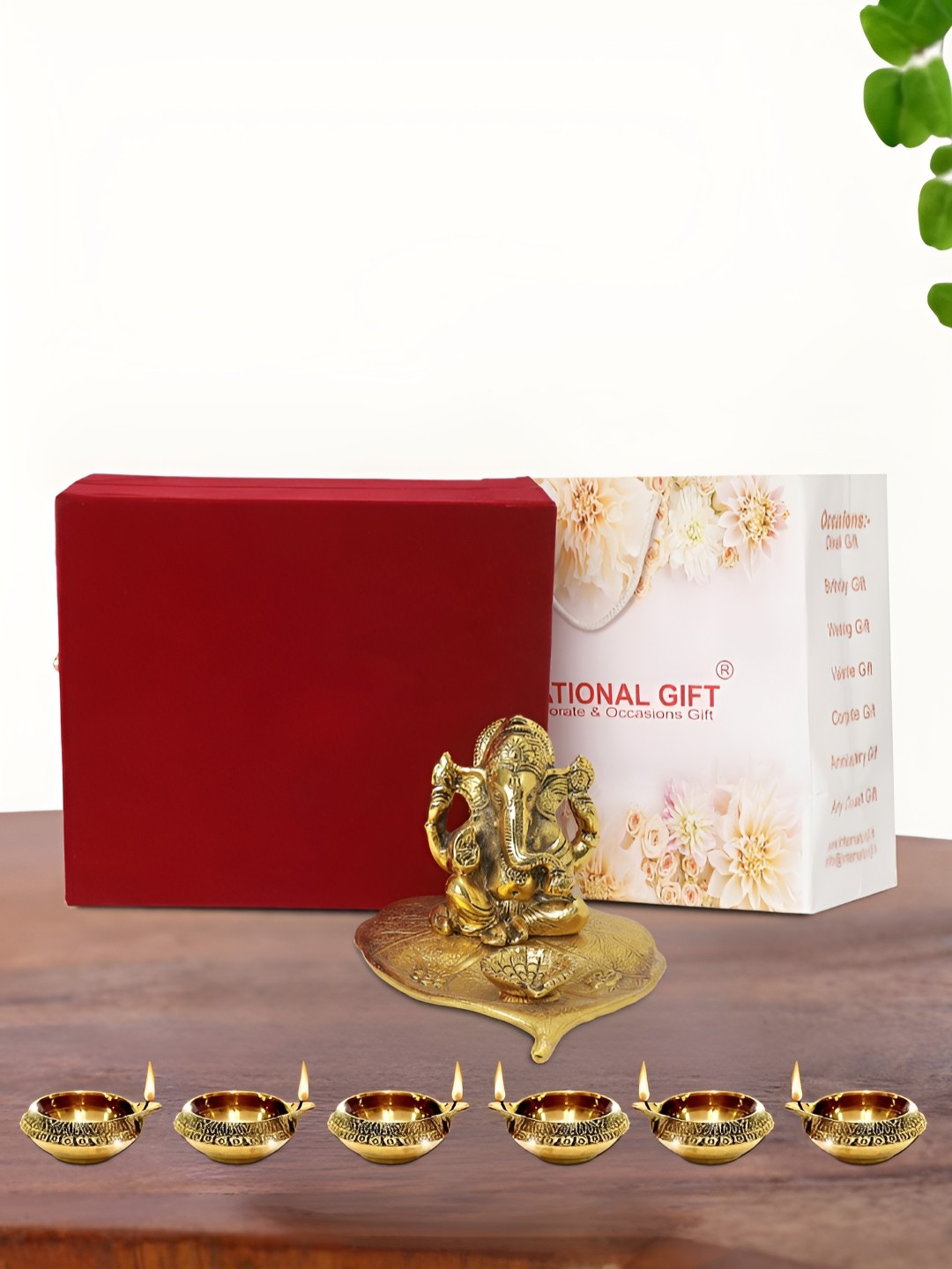 

INTERNATIONAL GIFT Gold Plated Leaf Ganesh Idol with 6 Diya Box and Bag