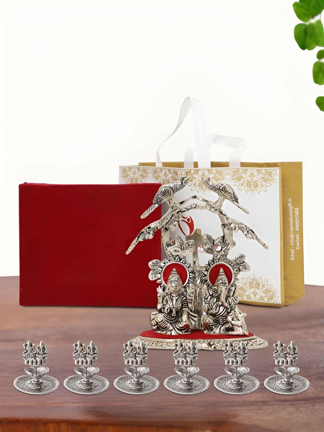 

INTERNATIONAL GIFT Silver Plated Laxmi Ganesh Idol with 6 Diya Box and Bag