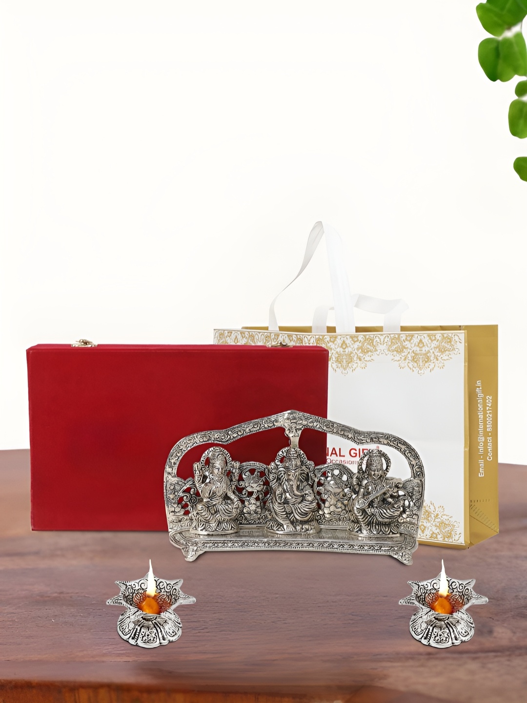 

INTERNATIONAL GIFT Silver Plated Laxmi Ganesh Saraswati Idol with 2 Diya and Box