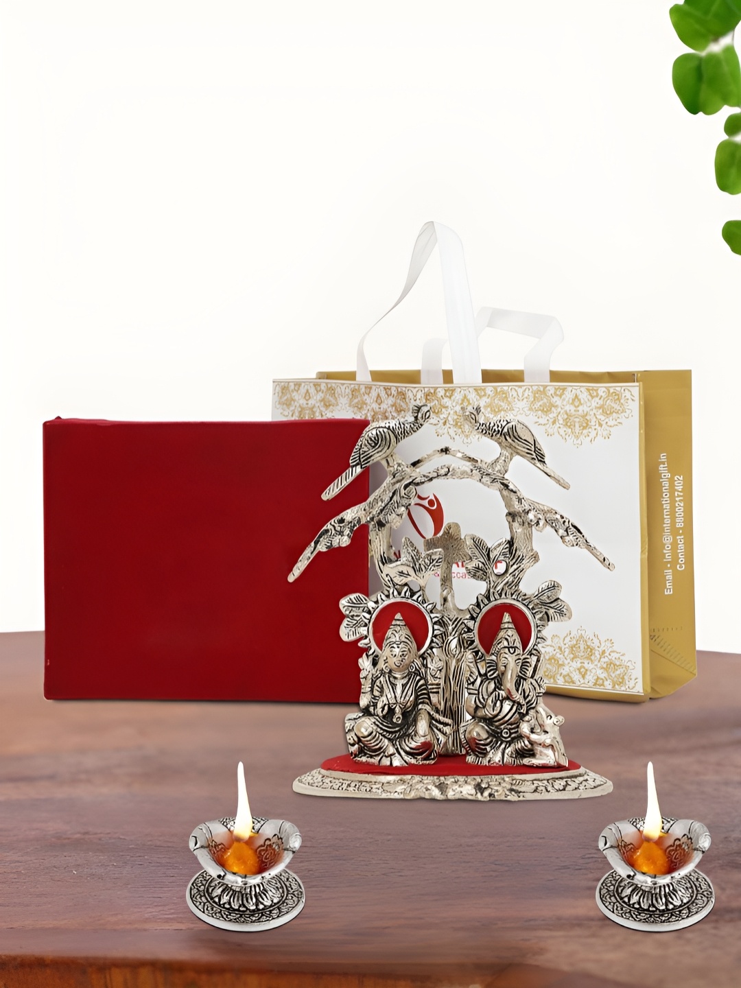 

INTERNATIONAL GIFT Silver Plated Laxmi Ganesh Idol with 2 Diya Box and Bag