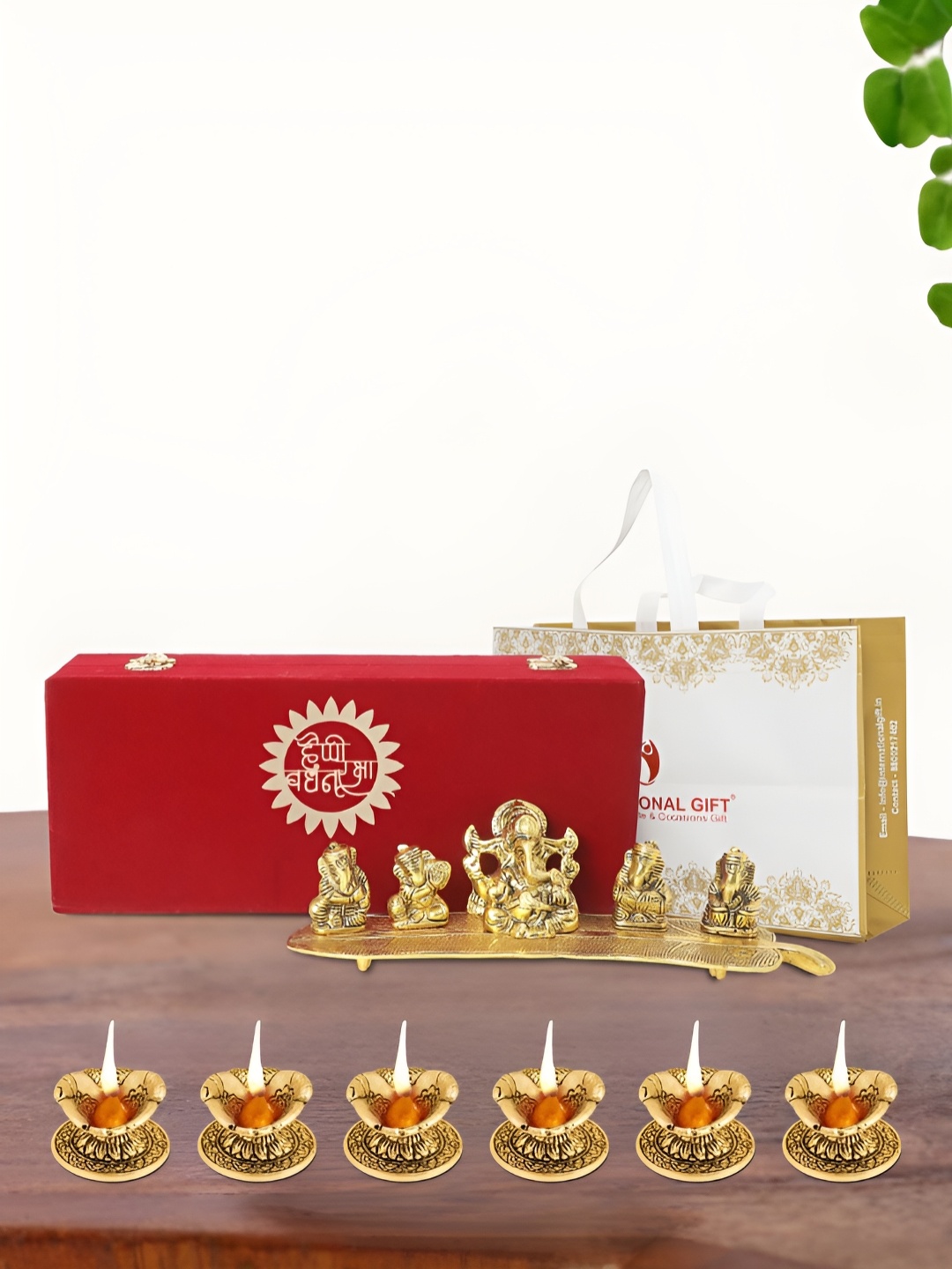 

INTERNATIONAL GIFT Gold Plated Musical Ganesh Idol with 6 Diya Box and Bag