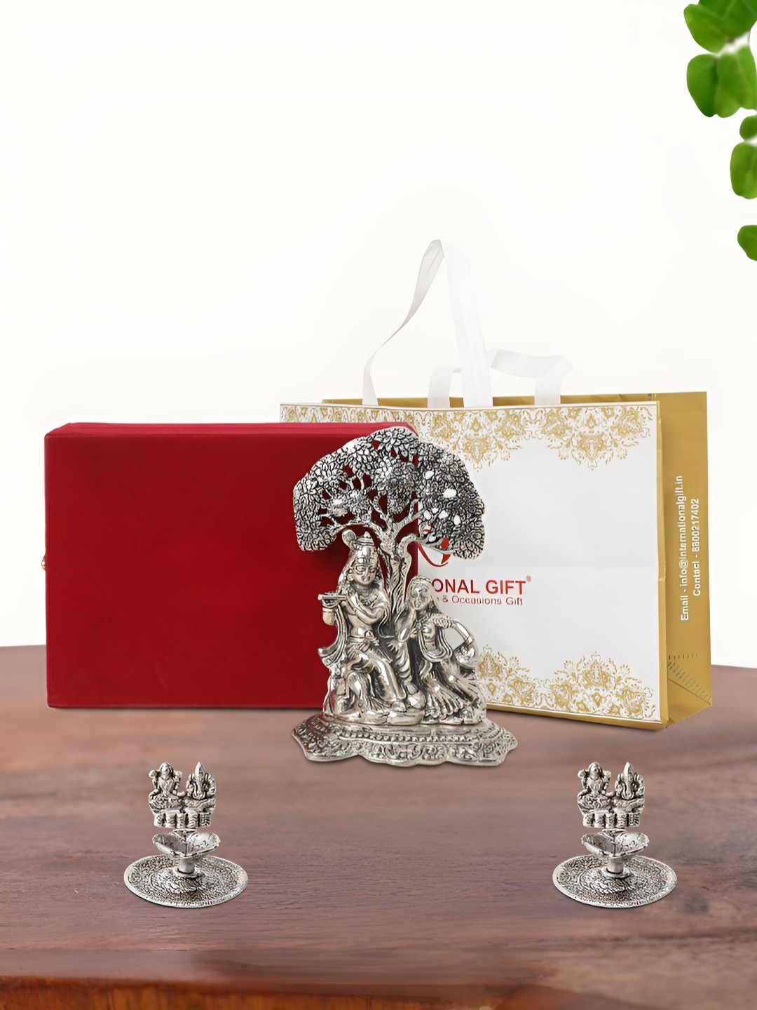 

INTERNATIONAL GIFT Silver Plated Radha Krishna Idol with 2 Diya Box and Bag