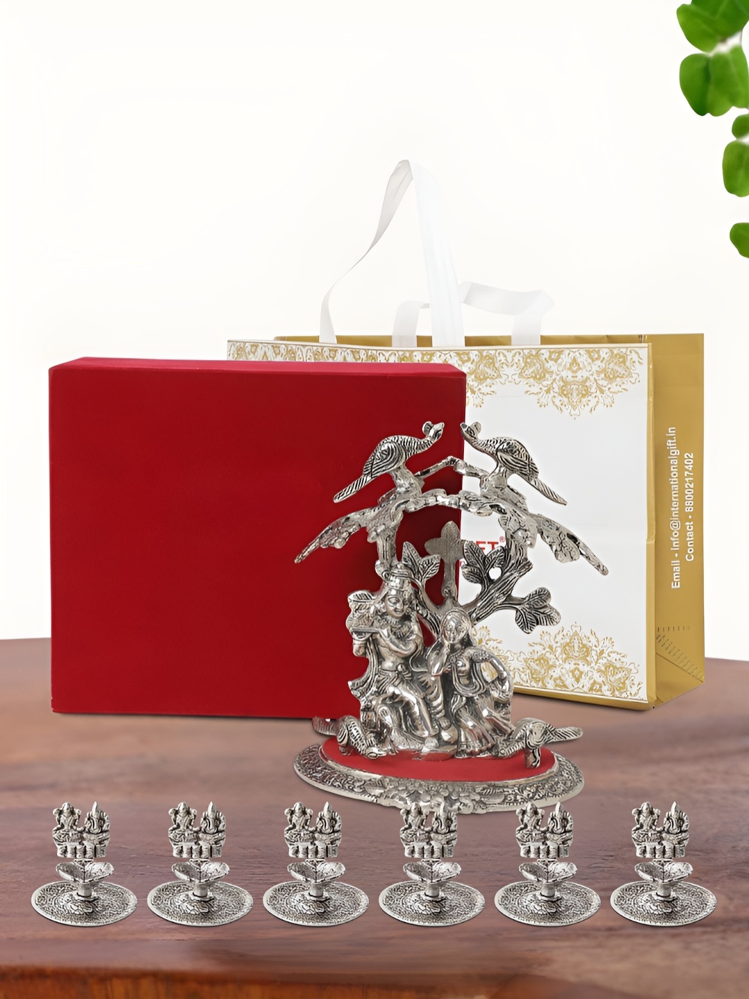 

INTERNATIONAL GIFT Silver Plated Radha Krishna Idol with 6 Diya Box and Bag