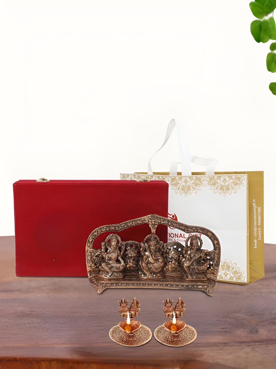

INTERNATIONAL GIFT Brown Laxmi Ganesh Saraswati Idol with 2 Diya Box and Bag, Copper