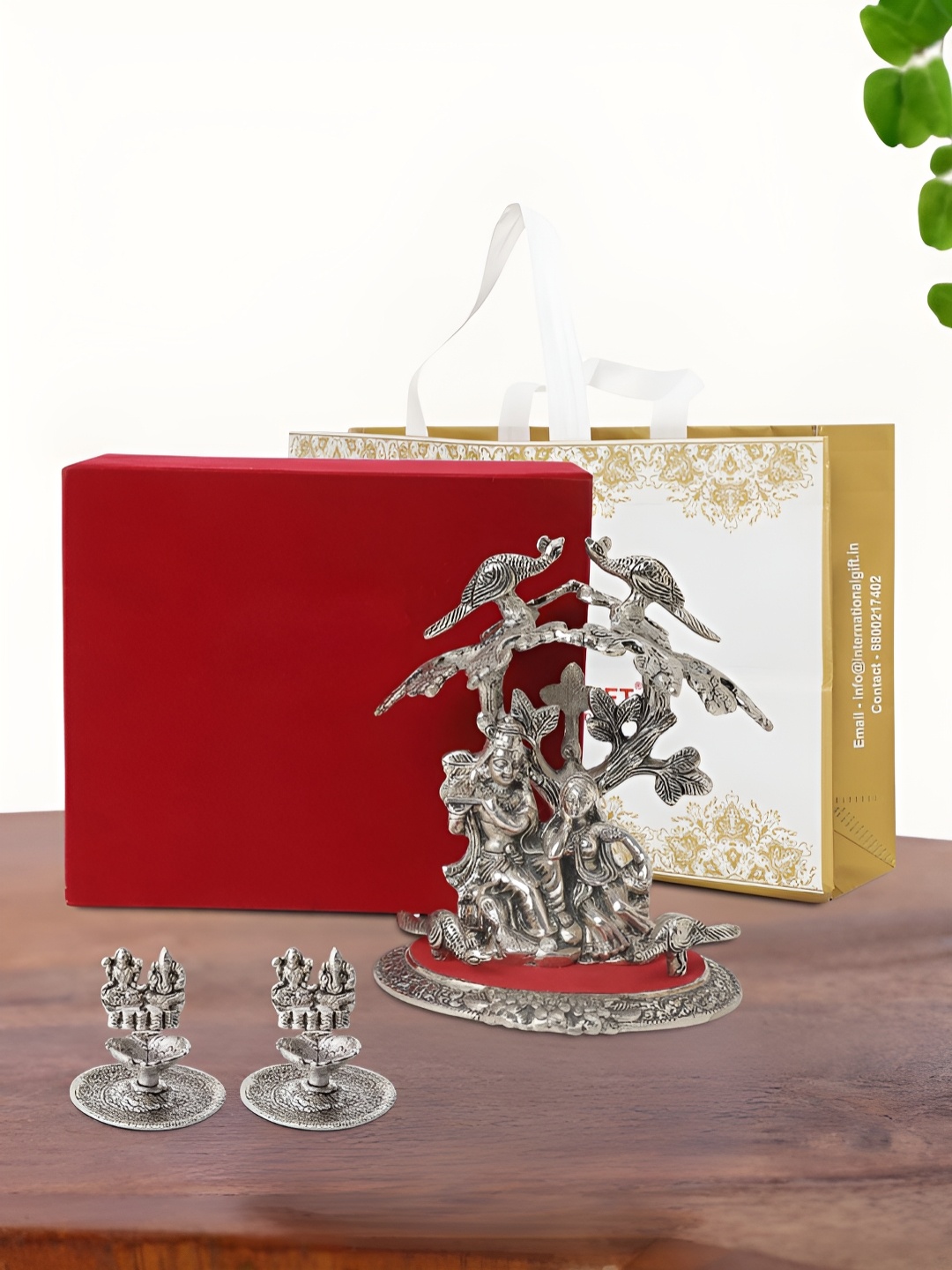 

INTERNATIONAL GIFT Silver Plated Radha Krishna Idol with 2 Diya Box and Bag