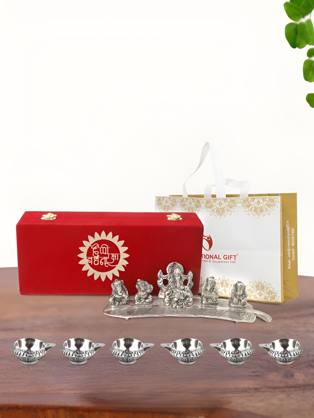 

INTERNATIONAL GIFT Silver Plated Musical Ganesh Idol with 6 Diya and Box