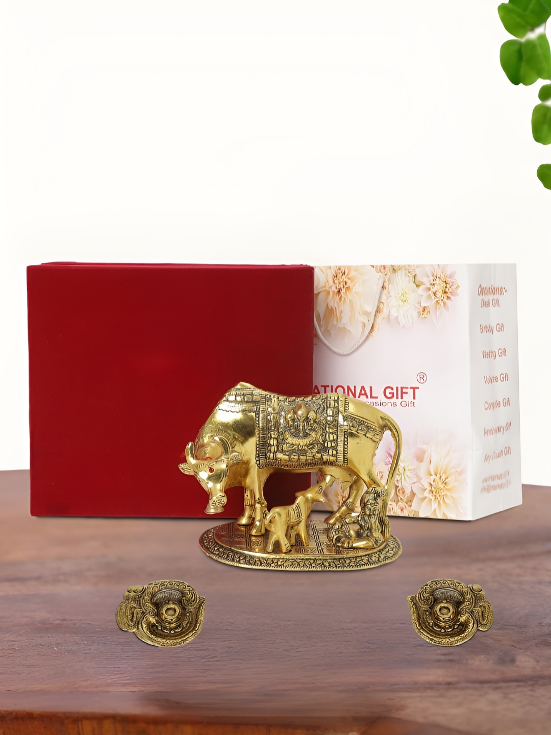 

INTERNATIONAL GIFT Gold Plated Kamdhenu Cow with 2 Diya and Box