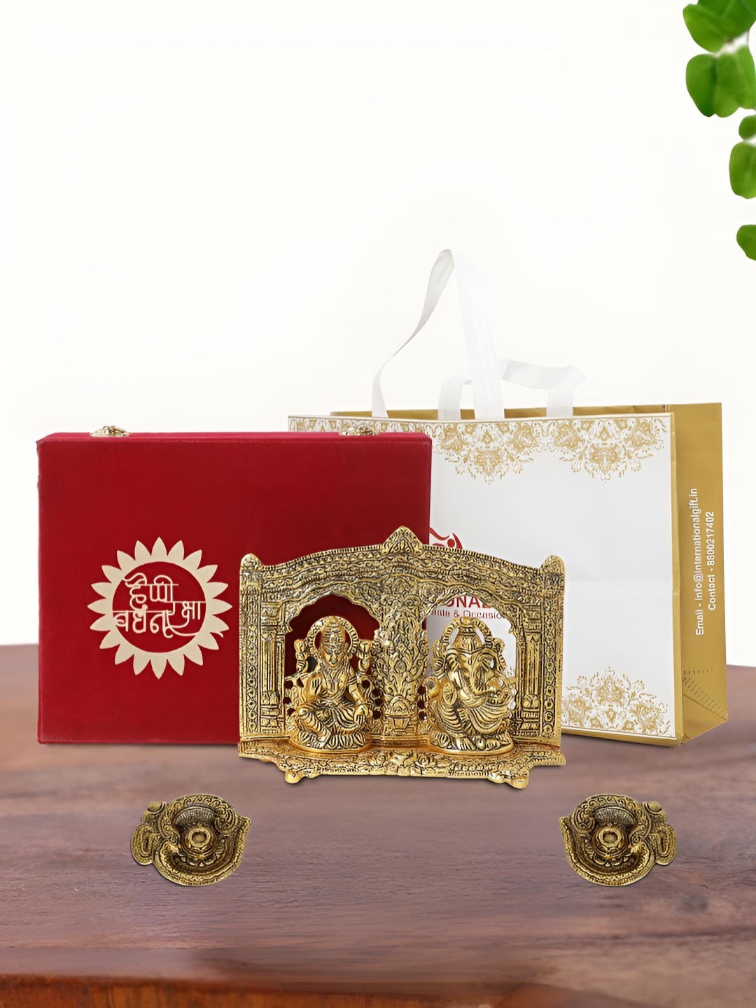 

INTERNATIONAL GIFT Gold Plated Laxmi Ganesh Idol with 2 Diya Box and Bag