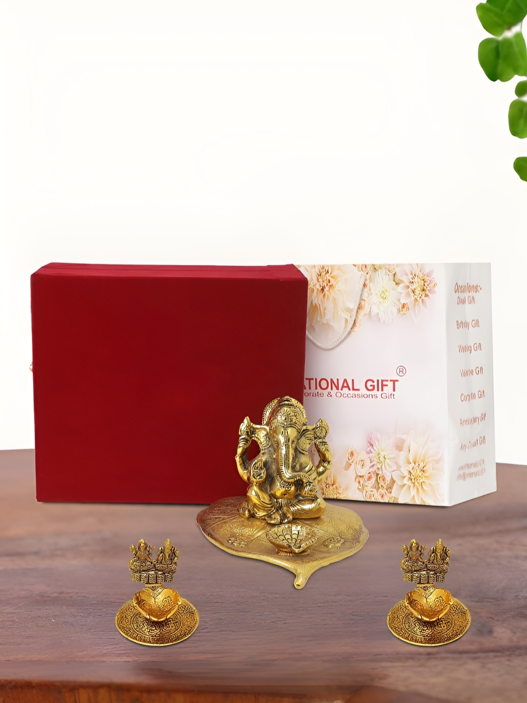 

INTERNATIONAL GIFT Gold Plated Leaf Ganesh Idol with 2 Diya Box and Bag