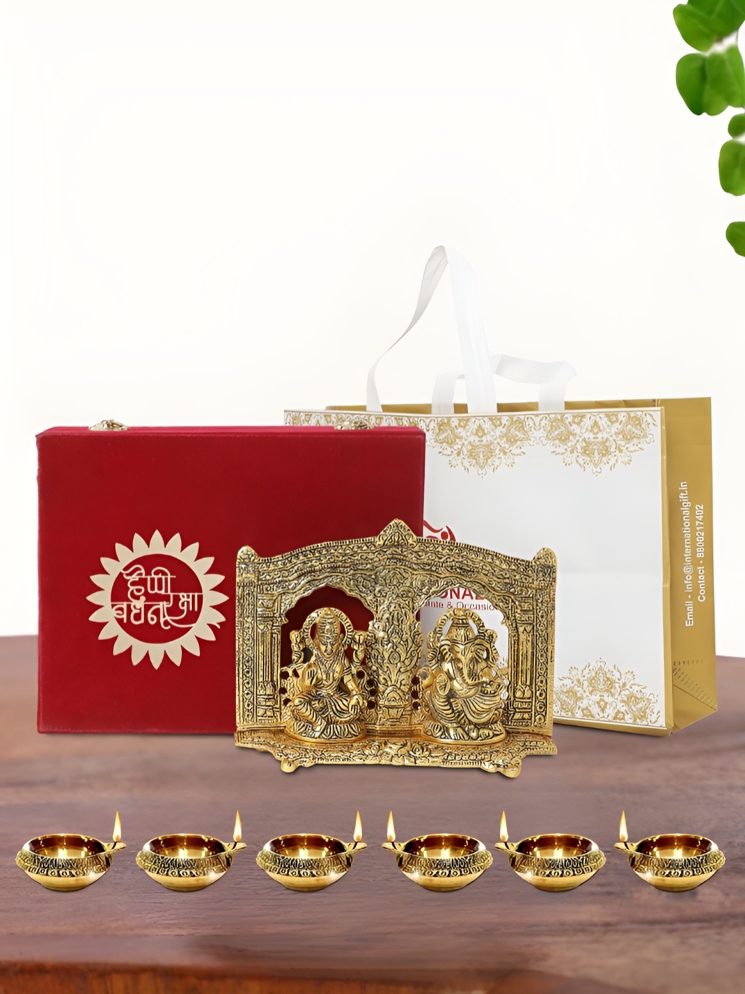 

INTERNATIONAL GIFT Gold Plated Laxmi Ganesh Idol with 6 Diya Box and Bag