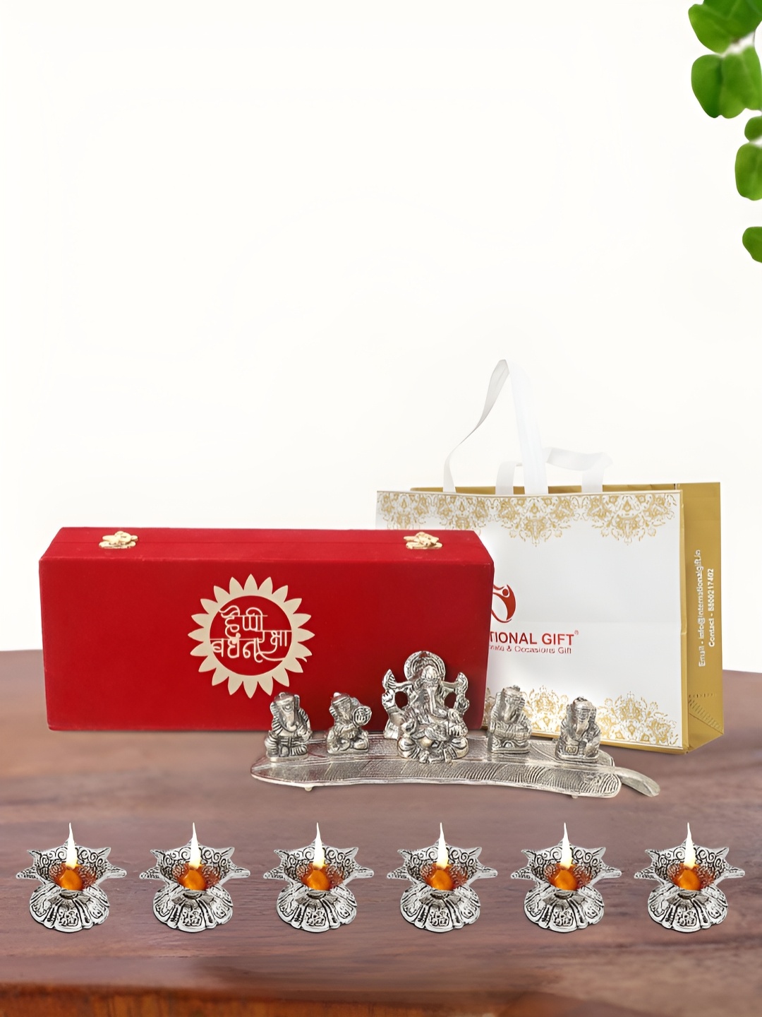 

INTERNATIONAL GIFT Silver Plated Musical Ganesh Idol with 6 Diya and Box