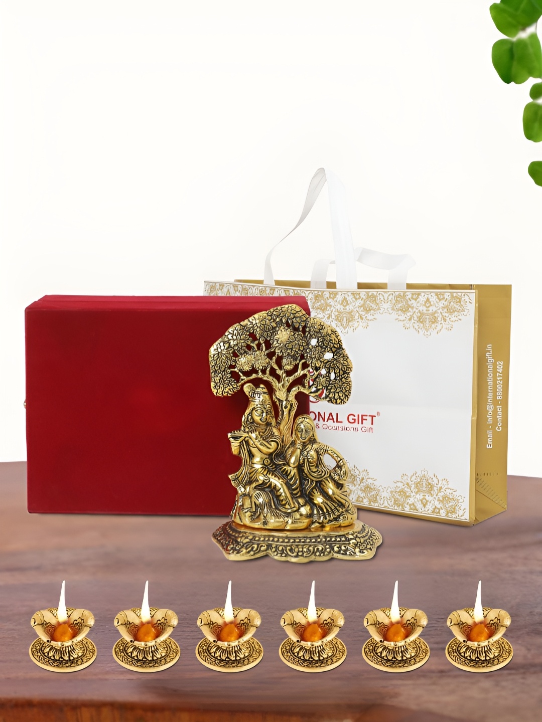 

INTERNATIONAL GIFT Gold Plated Radha Krishna Idol with 6 Diya Box and Bag