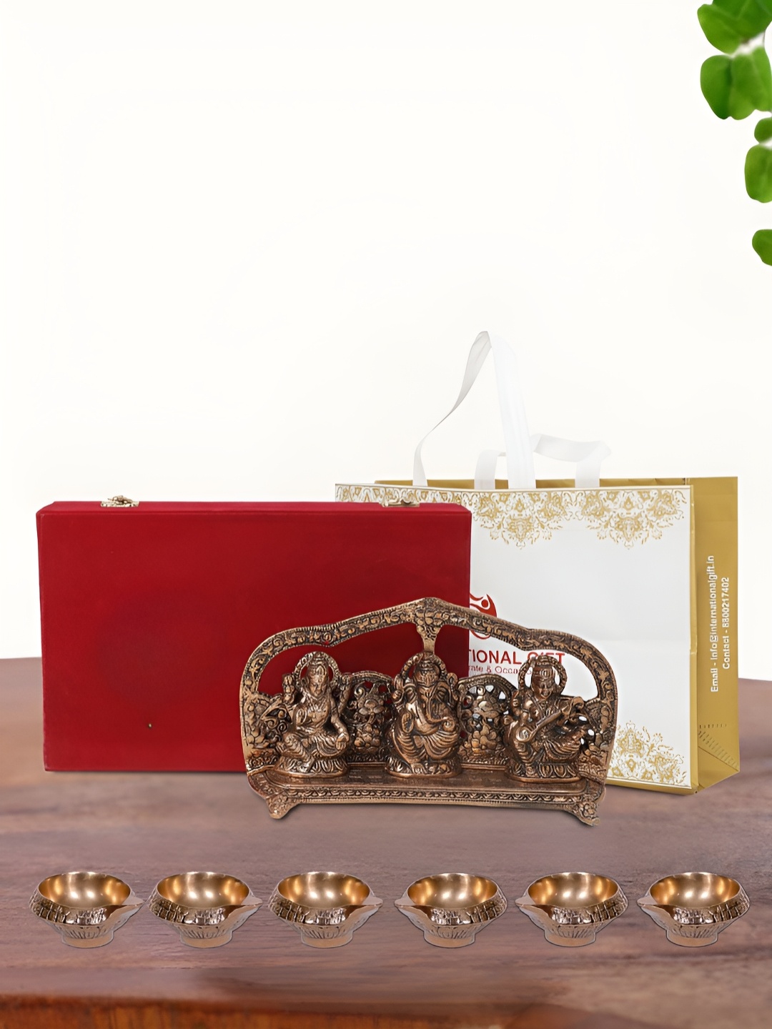 

INTERNATIONAL GIFT Brown Laxmi Ganesh Saraswati Idol with 6 Diya Box and Bag, Copper