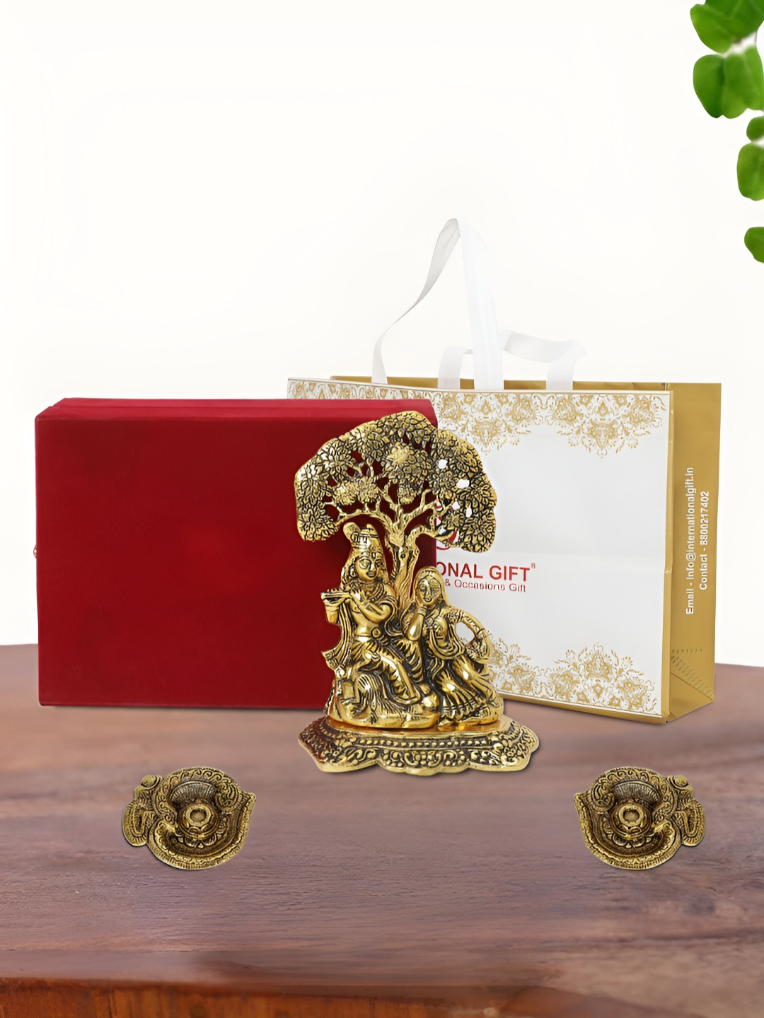 

INTERNATIONAL GIFT Gold Plated Radha Krishna Idol with 2 Diya Box and Bag