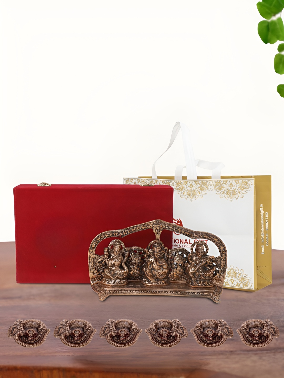 

INTERNATIONAL GIFT Brown Laxmi Ganesh Saraswati Idol with 6 Diya Box and Bag, Copper