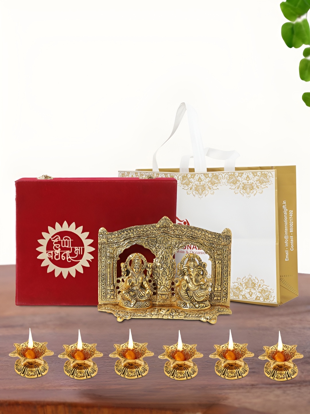 

INTERNATIONAL GIFT Gold Plated Laxmi Ganesh Idol with 6 Diya Box and Bag