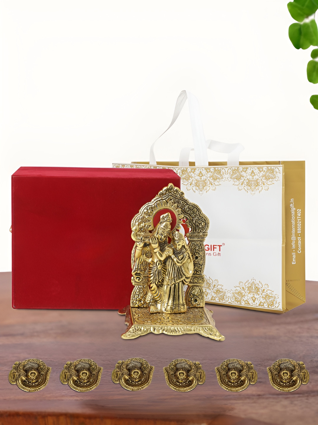 

INTERNATIONAL GIFT Gold Plated Radha Krishna Chowki with 6 Diya Box and Bag