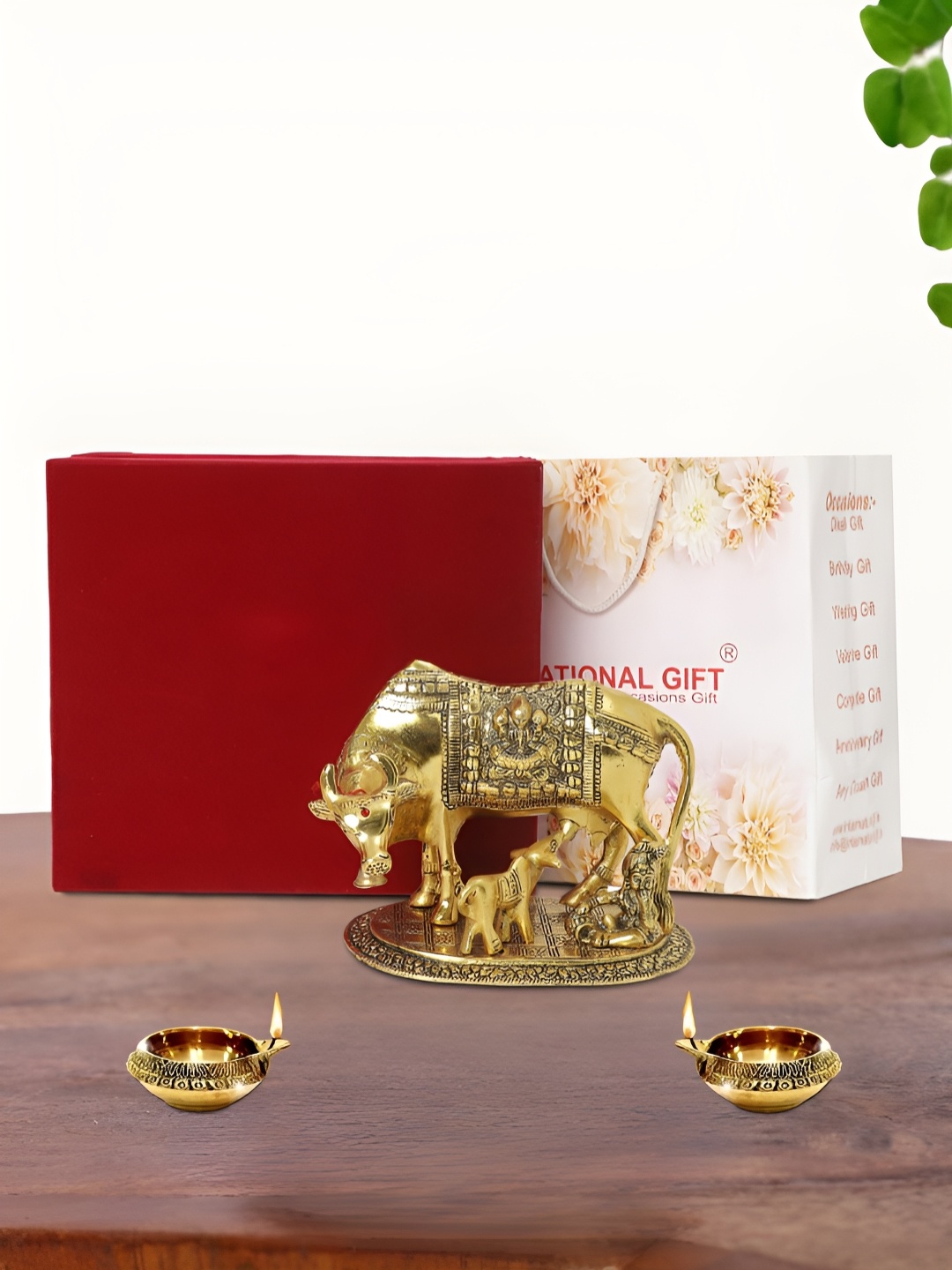 

INTERNATIONAL GIFT Gold Plated Kamdhenu Cow with 2 Diya and Box